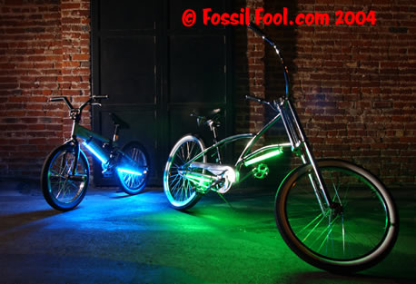 A BMX bike and chrome chopper with the Down Low Glow neon kit installed.